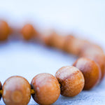 Sandalwood is a sacred wood with a lovely aromatic scent that is excellent for staying present and alert during meditation, which makes it wonderful for ritual and spiritual practice.  Its fragrance is said to transform desires, and also to bring emotional balance.