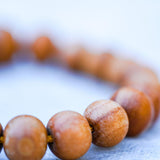 Sandalwood is a sacred wood with a lovely aromatic scent that is excellent for staying present and alert during meditation, which makes it wonderful for ritual and spiritual practice.  Its fragrance is said to transform desires, and also to bring emotional balance.