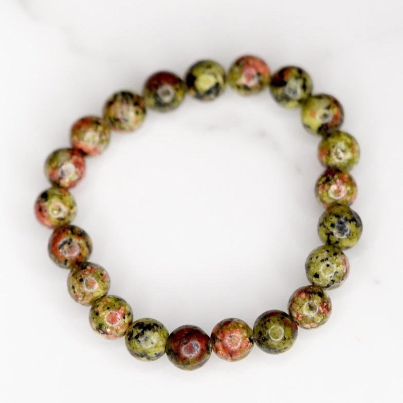 Unakite is said to be a stone of vision, opening the third eye and useful for scrying. It is also believed to be a stone of balance, grounding the self while bringing emotions and spirituality together.