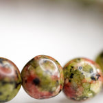 Unakite is said to be a stone of vision, opening the third eye and useful for scrying. It is also believed to be a stone of balance, grounding the self while bringing emotions and spirituality together.