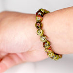 Unakite is said to be a stone of vision, opening the third eye and useful for scrying. It is also believed to be a stone of balance, grounding the self while bringing emotions and spirituality together.