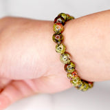 Unakite is said to be a stone of vision, opening the third eye and useful for scrying. It is also believed to be a stone of balance, grounding the self while bringing emotions and spirituality together.