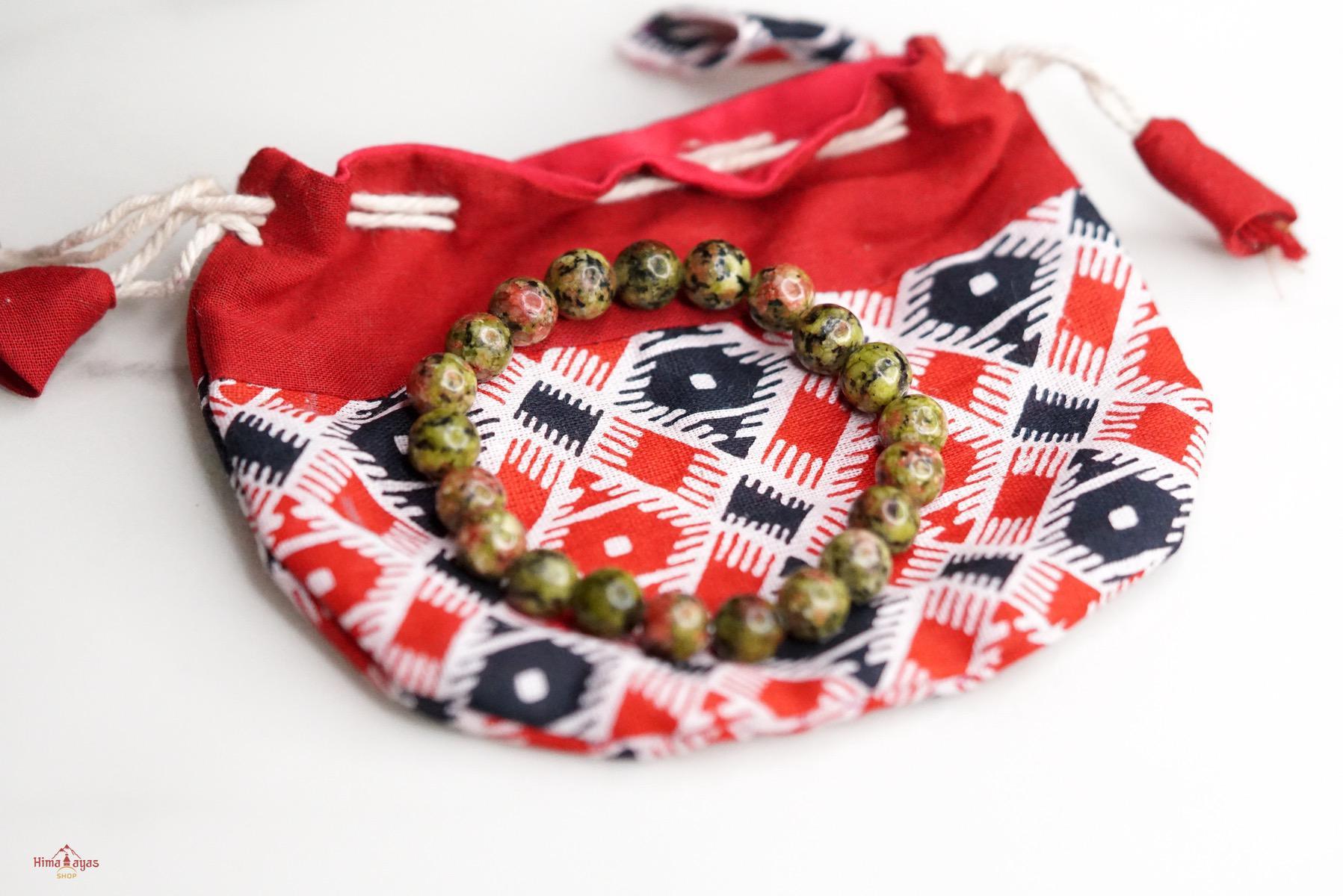 Unakite is said to be a stone of vision, opening the third eye and useful for scrying. It is also believed to be a stone of balance, grounding the self while bringing emotions and spirituality together.