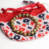 Unakite is said to be a stone of vision, opening the third eye and useful for scrying. It is also believed to be a stone of balance, grounding the self while bringing emotions and spirituality together.