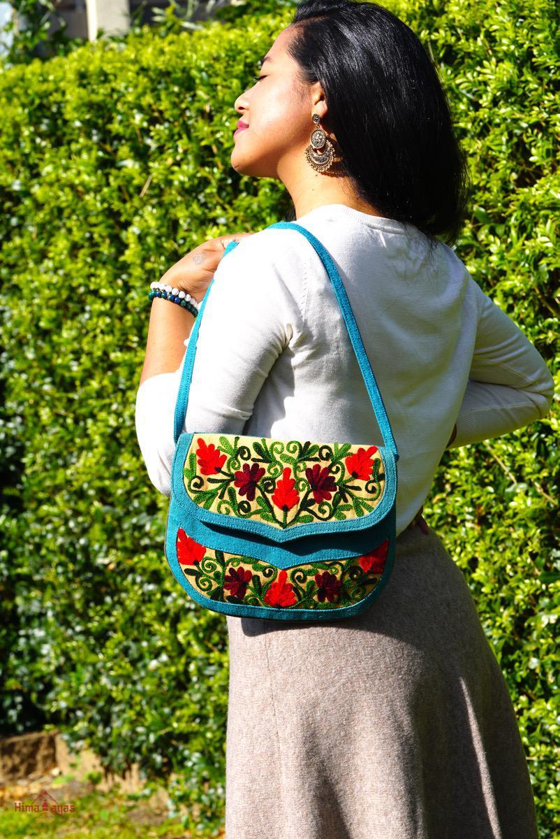 Beautiful handmade women's crossbody bag with floral embroidery design for chic boho style.