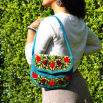 Beautiful handmade women's crossbody bag with floral embroidery design for chic boho style.