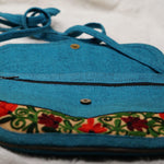 Beautiful handmade women's crossbody bag with floral embroidery design for chic boho style.