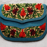 Beautiful handmade women's crossbody bag with floral embroidery design for chic boho style.