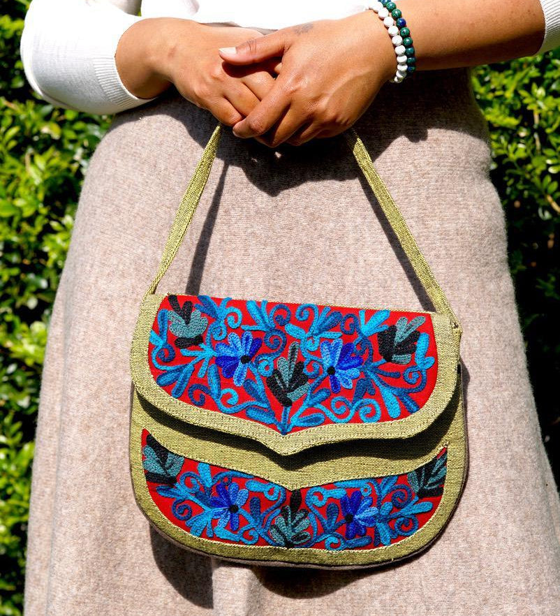 Beautiful hand embroidered crossbody bag with bright and multi-colour embroidered floral patterns.