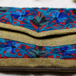Beautiful hand embroidered crossbody bag with bright and multi-colour embroidered floral patterns.
