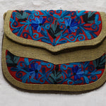 Beautiful hand embroidered crossbody bag with bright and multi-colour embroidered floral patterns.