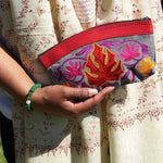 A special women pouch very light weight, ideal as a makeup bag or everyday use hand purse.