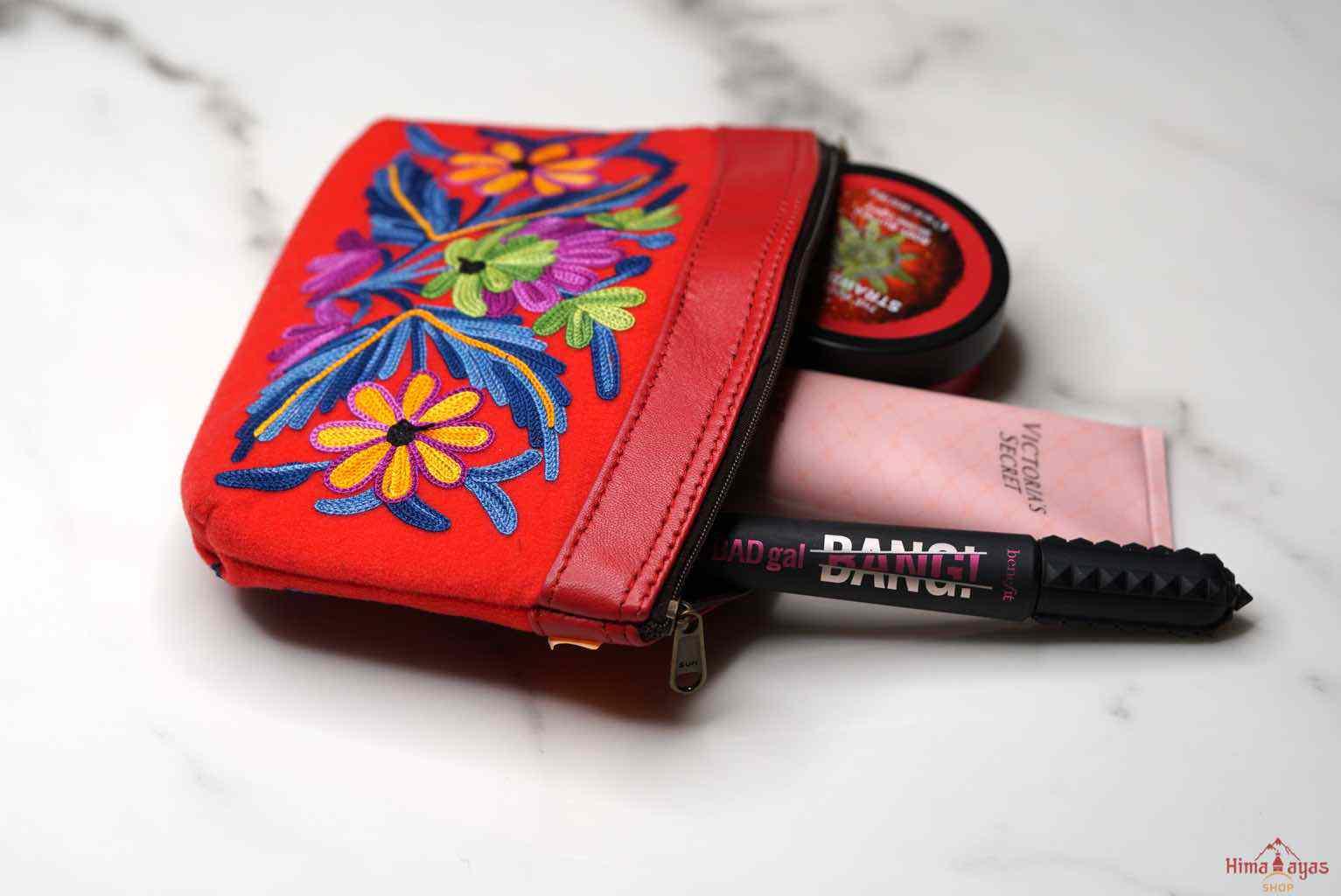 Beautiful Cashmere design pouch made with hand-embroidery design with a very fine embellishment that involves elaborate and intricate floral motifs.