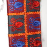 Vibrant colorful purse with kashmiri hand embroidery, has a secure zip top closure, ethically made in Nepal.