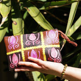 Vibrant colorful purse with kashmiri hand embroidery, has a secure zip top closure, ethically made in Nepal.