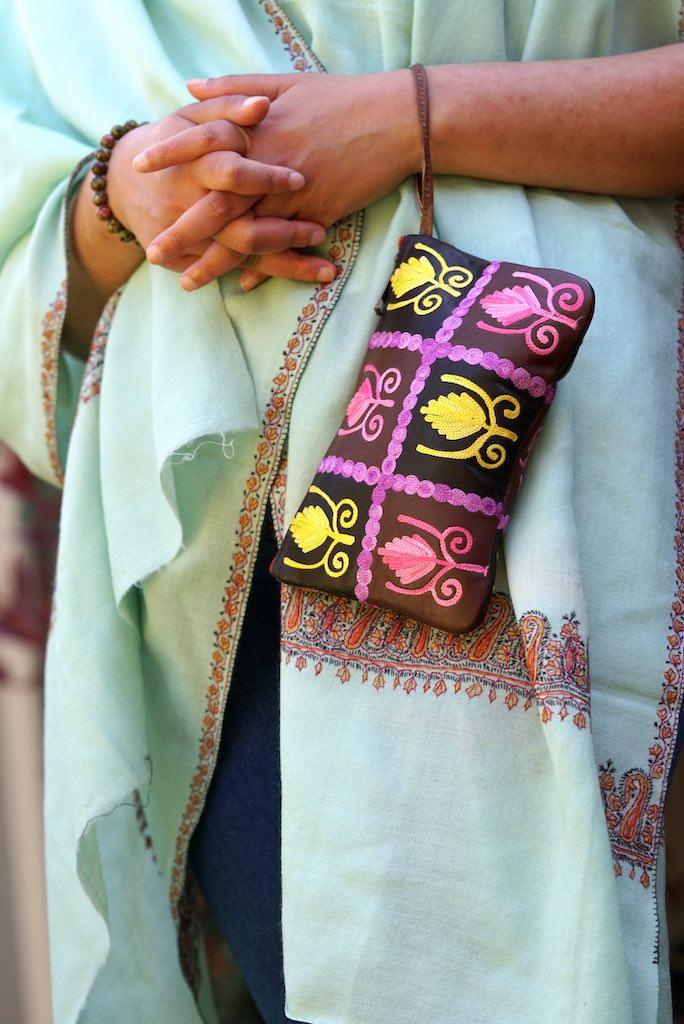 Vibrant colorful purse with kashmiri hand embroidery, has a secure zip top closure, ethically made in Nepal.Vibrant colorful purse with kashmiri hand embroidery, has a secure zip top closure, ethically made in Nepal.