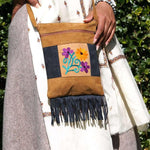 Easy to carry side bag for women, features a beautiful hand embroidered floral pattern.