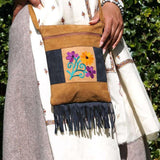 Easy to carry side bag for women, features a beautiful hand embroidered floral pattern.
