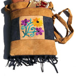 Easy to carry side bag for women, features a beautiful hand embroidered floral pattern.