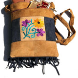 Easy to carry side bag for women, features a beautiful hand embroidered floral pattern.