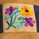 Easy to carry side bag for women, features a beautiful hand embroidered floral pattern.