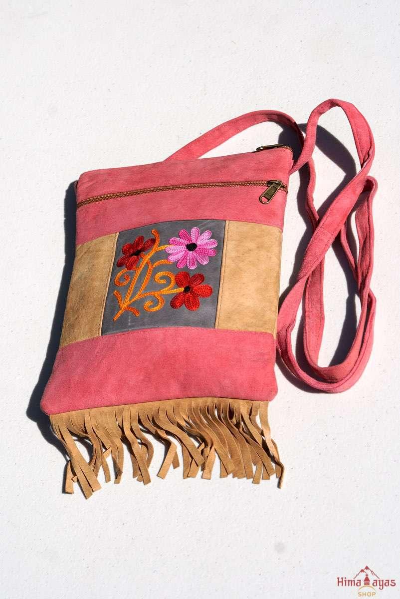 Easy to carry side bag for women, features a beautiful hand embroidered floral pattern.