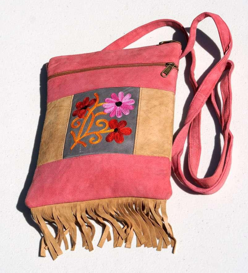 Easy to carry side bag for women, features a beautiful hand embroidered floral pattern.