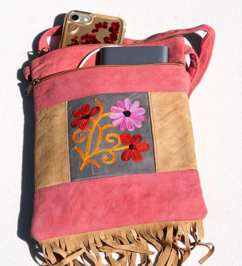 Easy to carry side bag for women, features a beautiful hand embroidered floral pattern.