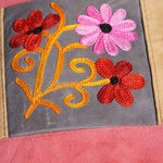 Easy to carry side bag for women, features a beautiful hand embroidered floral pattern.