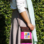 Easy to carry side bag for women, features a beautiful hand embroidered floral pattern.