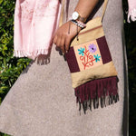 Easy to carry side bag for women, features a beautiful hand embroidered floral pattern.