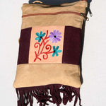 Easy to carry side bag for women, features a beautiful hand embroidered floral pattern.
