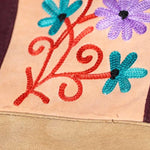 Easy to carry side bag for women, features a beautiful hand embroidered floral pattern.