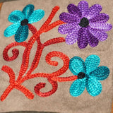 A unique style women's sling bag, crafted with beautiful cashmere floral embroidery to give it a chic stylish look.
