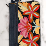 A stylish yet convenient hand woven wristlet purse with beautiful floral pattern, It has a secure zip top closure and two extra compartments for your everyday essentials making it easy to travel simple and light.