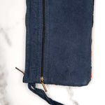 A stylish yet convenient hand woven wristlet purse with beautiful floral pattern, It has a secure zip top closure and two extra compartments for your everyday essentials making it easy to travel simple and light.