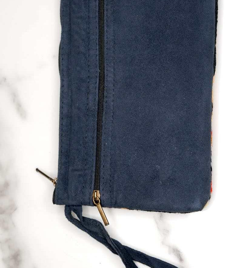 A stylish yet convenient hand woven wristlet purse with beautiful floral pattern, It has a secure zip top closure and two extra compartments for your everyday essentials making it easy to travel simple and light.