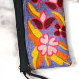 Beautiful flower pattern woman's purse that features a wristlet and secure zip top closure.
