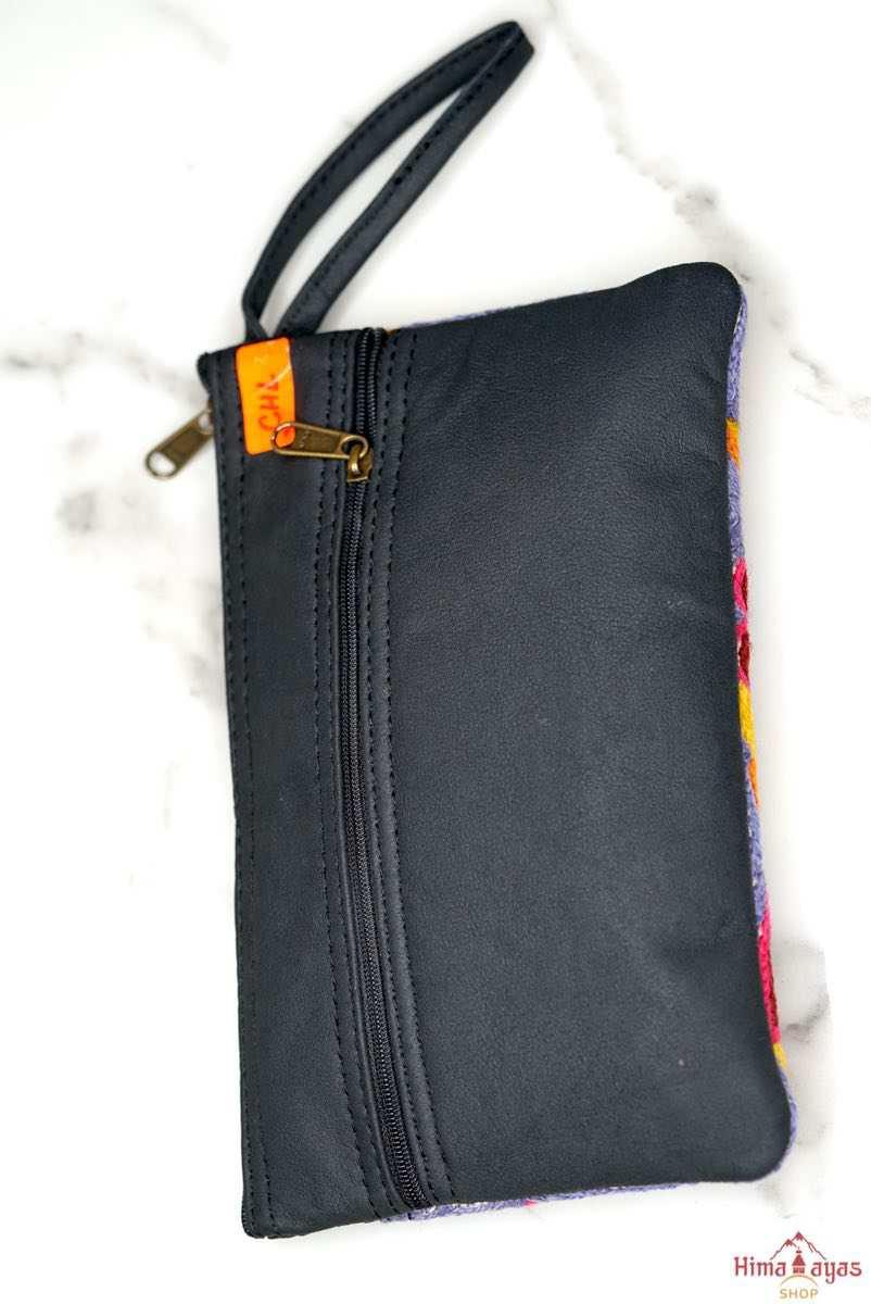 Beautiful flower pattern woman's purse that features a wristlet and secure zip top closure.