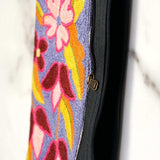 Beautiful flower pattern woman's purse that features a wristlet and secure zip top closure.
