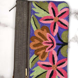 A stylish yet convenient hand woven wristlet purse with beautiful floral pattern, It has a secure zip top closure and two extra compartments for your everyday essentials making it easy to travel simple and light.