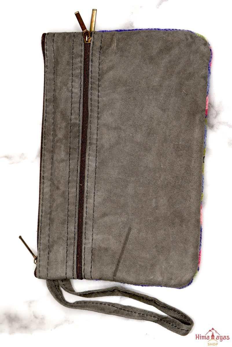 A stylish yet convenient hand woven wristlet purse with beautiful floral pattern, It has a secure zip top closure and two extra compartments for your everyday essentials making it easy to travel simple and light.