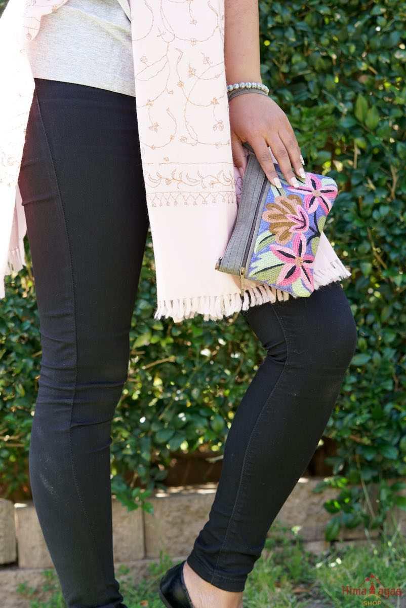 A stylish yet convenient hand woven wristlet purse with beautiful floral pattern, It has a secure zip top closure and two extra compartments for your everyday essentials making it easy to travel simple and light.