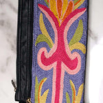 A stylish and ethically made wristlet purse to carry all your everyday essentials.