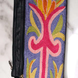 A stylish and ethically made wristlet purse to carry all your everyday essentials.