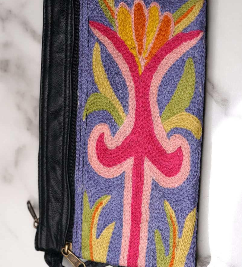 A stylish and ethically made wristlet purse to carry all your everyday essentials.