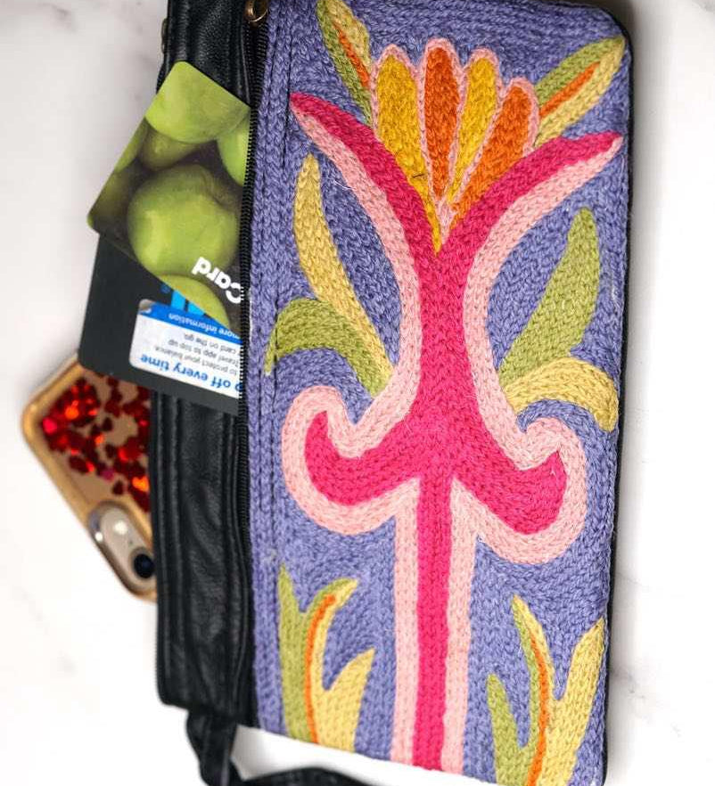 A stylish and ethically made wristlet purse to carry all your everyday essentials.