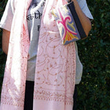 A stylish and ethically made wristlet purse to carry all your everyday essentials.