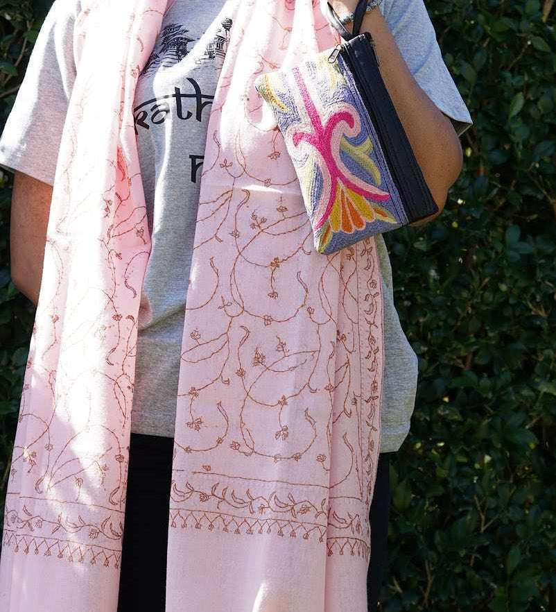 A stylish and ethically made wristlet purse to carry all your everyday essentials.