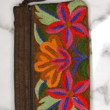 A stylish yet convenient hand woven wristlet purse with beautiful floral pattern, It has a secure zip top closure and two extra compartments for your everyday essentials making it easy to travel simple and light.